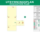 Utrymningsplan med symboler som visar brandsläckare, utrymningsvägar och återsamlingsplats.