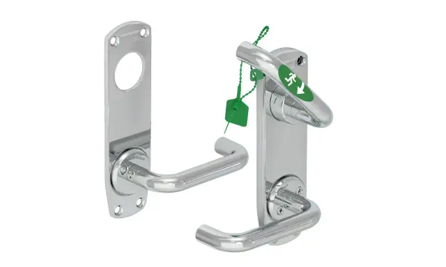 Chrome door handles, one with an emergency exit sign and green tag.